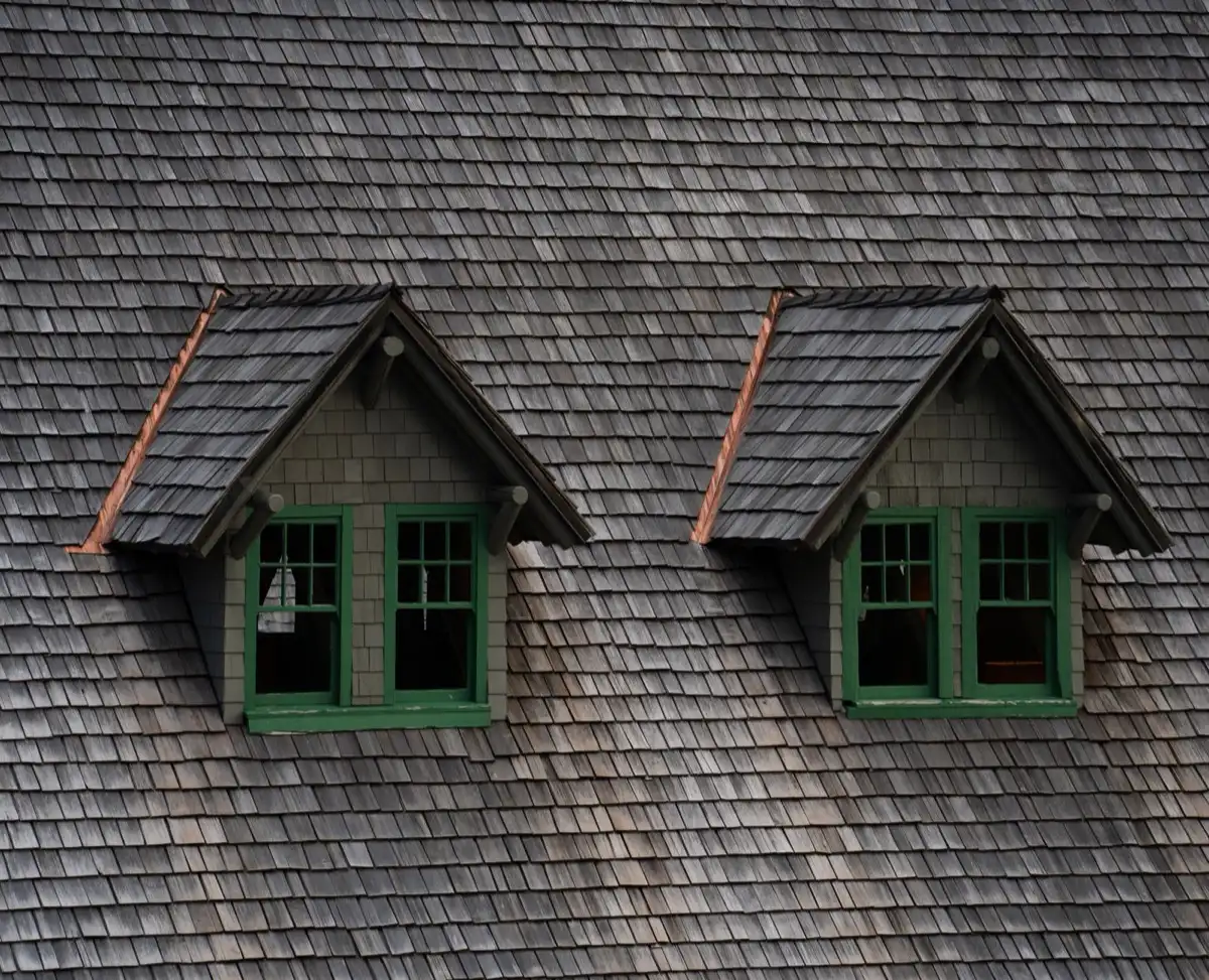 Dormers on a shingle roof in Roseville, CA, where step flashing and kickout flashing carry water past the walls