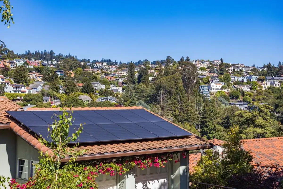 Hips and valleys across a run of rooflines in Roseville, CA, where two planes meet and hand their water to one line